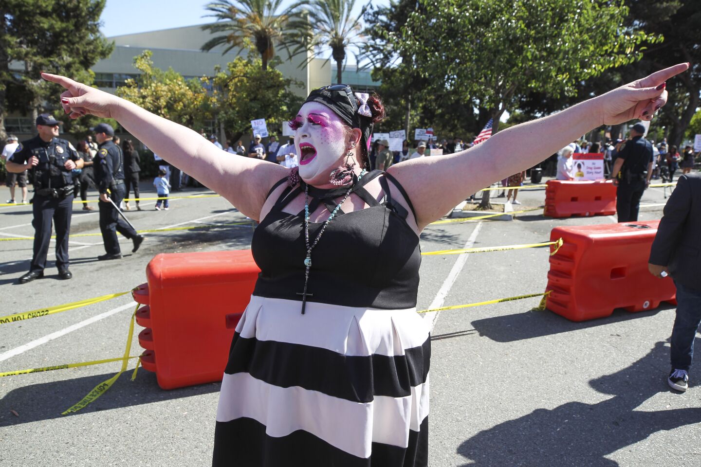 Sister April Hamm Linkin, with the San Diego Sisters of Perpetual Indulgence, leads other supporters of the Drag Queen Story Hour in a chant at the Chula Vista Public Library, Civic Center Branch, on Tuesday, September 10, 2019 in Chula Vista, California.