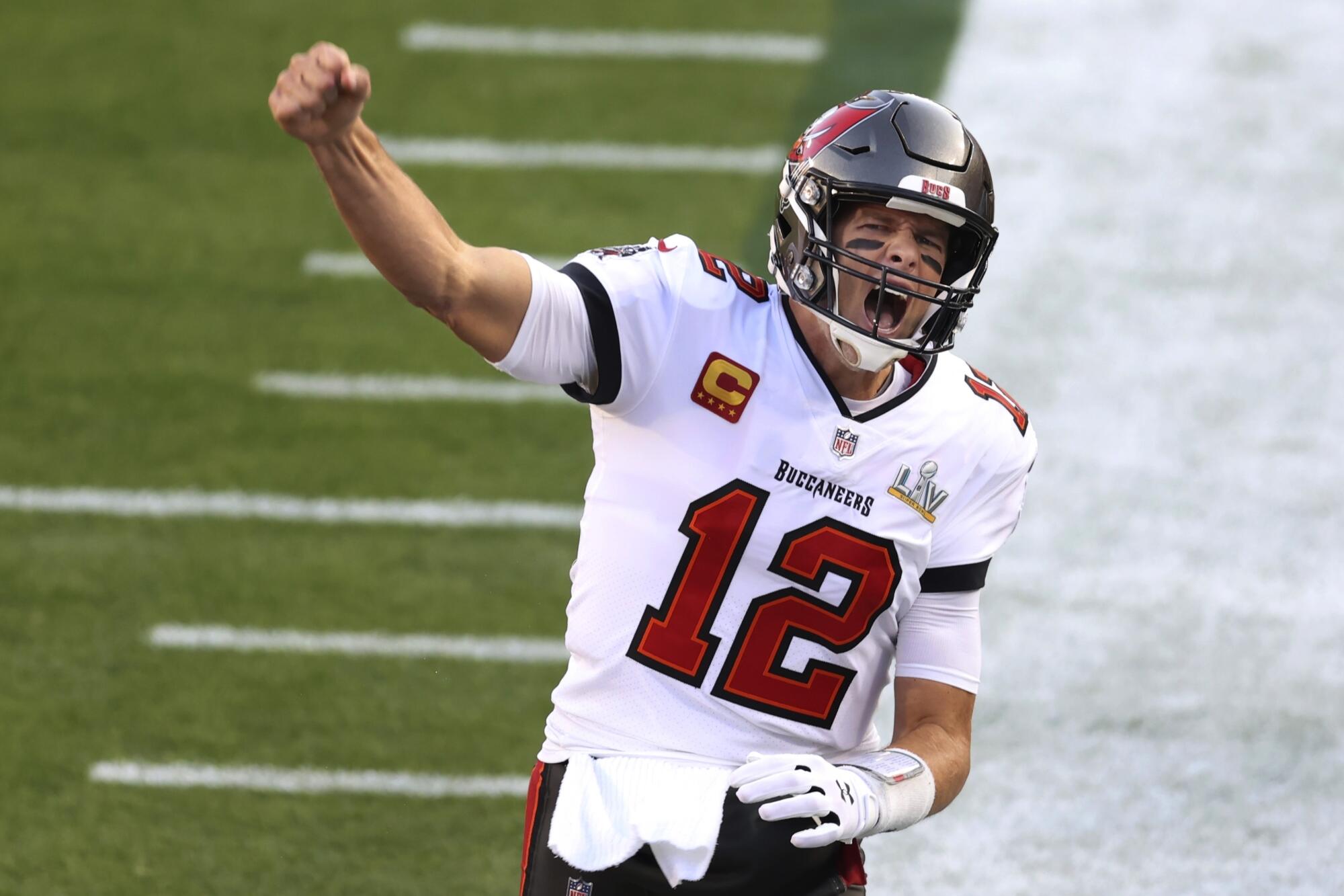 Tampa Bay Buccaneers quarterback Tom Brady shouts as he runs onto the field.