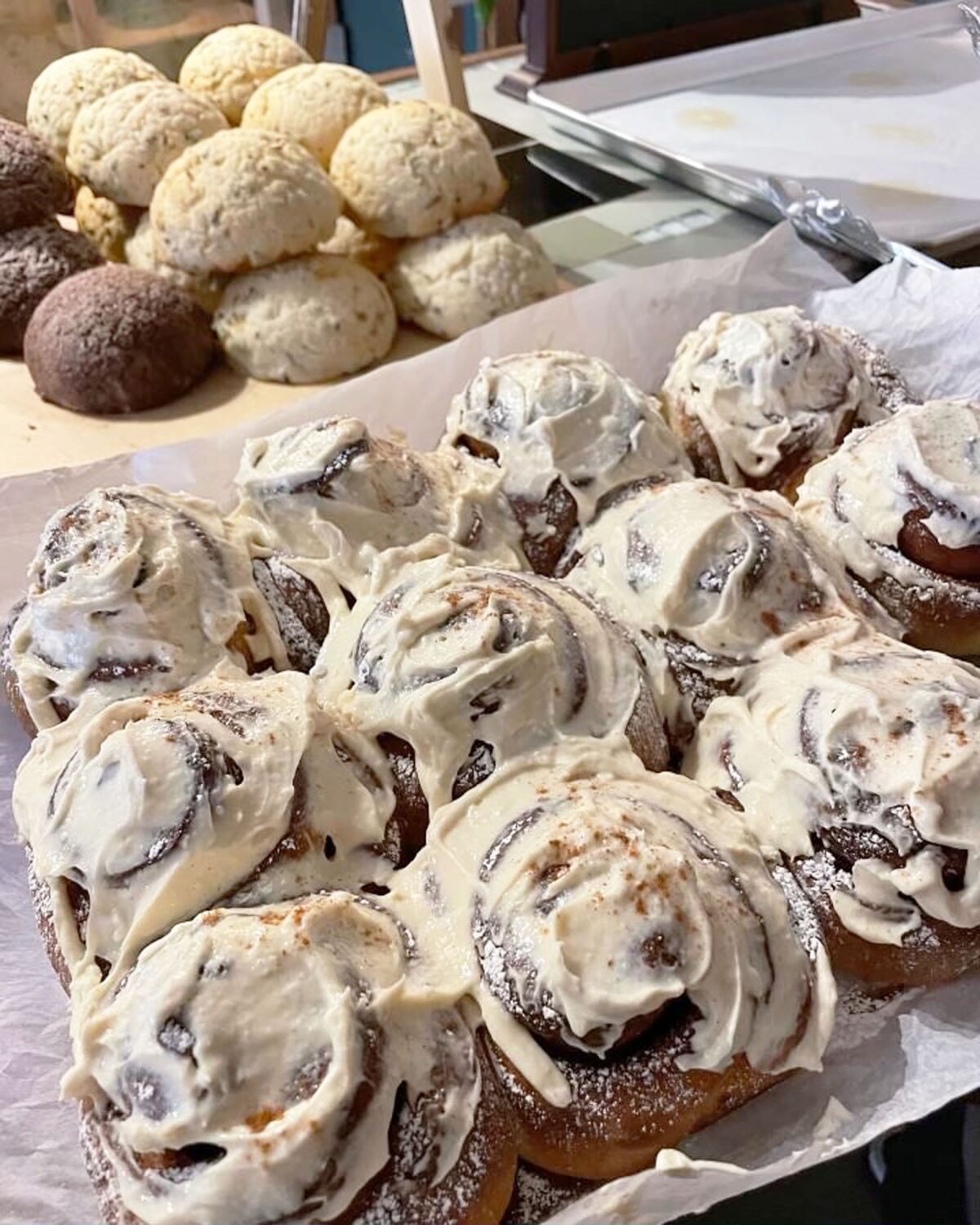 Sweet buns covered in frosting are among the items sold at Wildwood Flour in Pacific Beach.