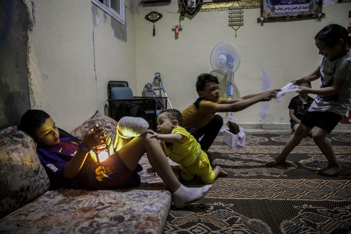 Abdel-Rahman with his siblings at their home. (Marcus Yam / Los Angeles Times)