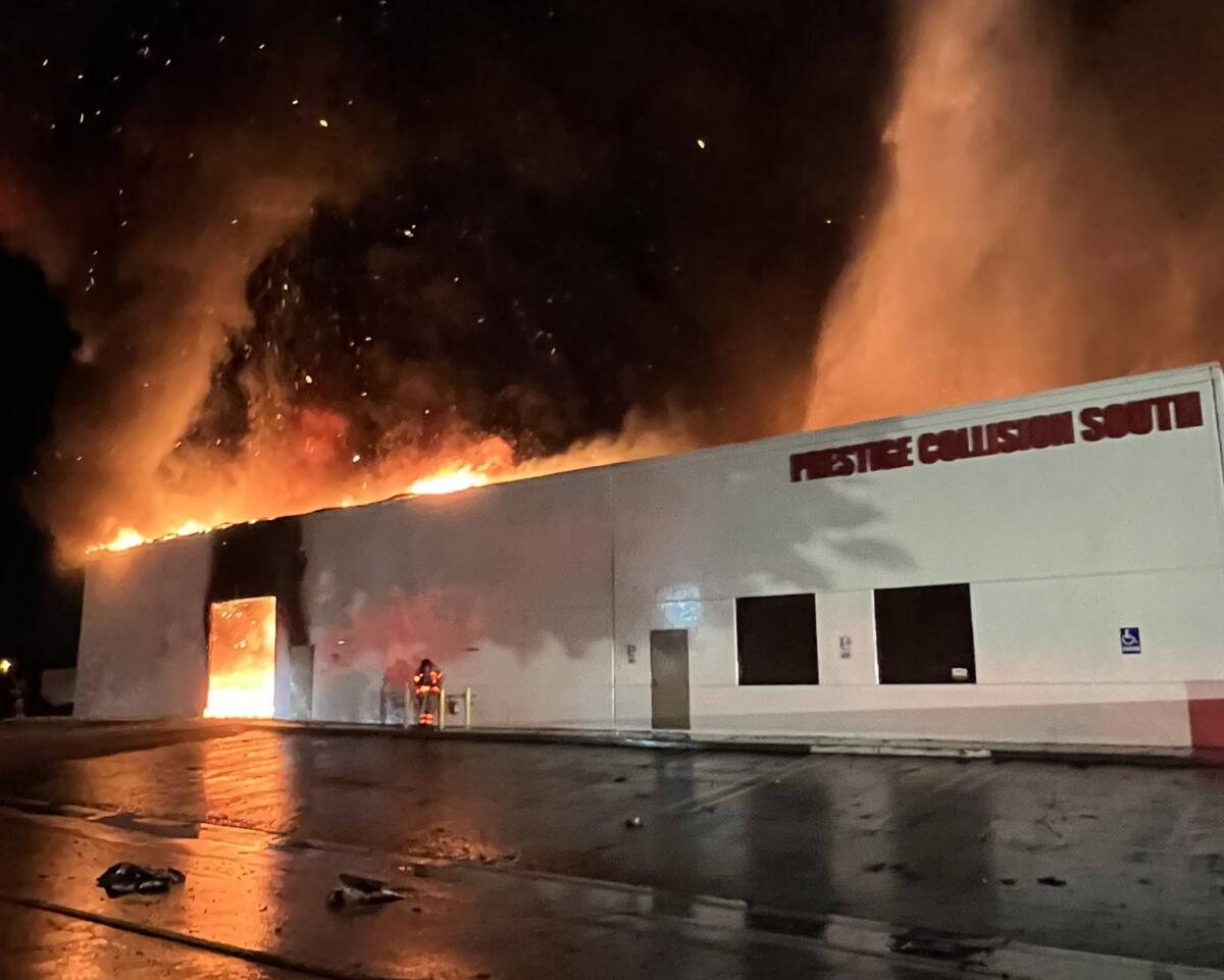 A commercial building engulfed in flames