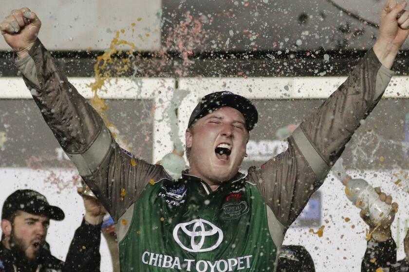 Austin Hill celebrates in Victory Lane after winning a NASCAR Truck Series auto race at Daytona International Speedway, Friday, Feb. 15, 2019, in Daytona Beach, Fla. (AP Photo/John Raoux)