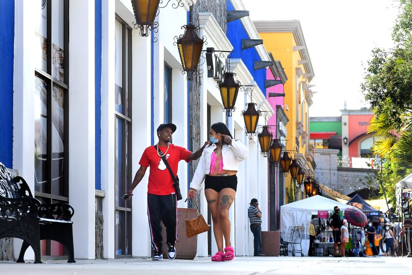 LYNWOOD, CALIFORNIA AUGUST 5, 2020-Customers walk at the Plaza Mexico in Lynwood Wednesday. The neighborhood has become the epicenter for the cornavirus along with Bell, Paramount and South Gate. (Wally Skalij/Los Angeles Times)