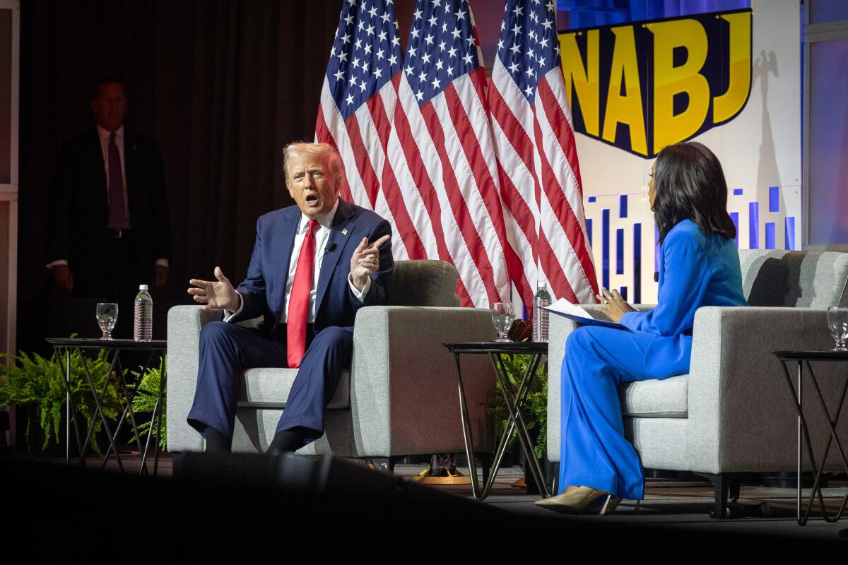 Former President Trump with Rachel Scott of ABC News at the National Assn. of Black Journalists convention.