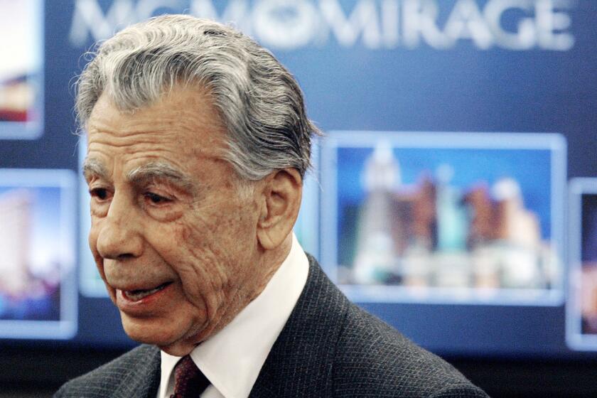 In this Feb. 22, 2005 file photo, Kirk Kerkorian, majority shareholder of MGM Mirage, speaks to the media at the Nevada Gaming Control Board hearing in Las Vegas. Kerkorian, an eighth-grade dropout who built Las Vegas' biggest hotels, tried to take over Chrysler and bought and sold MGM at a profit three times.
