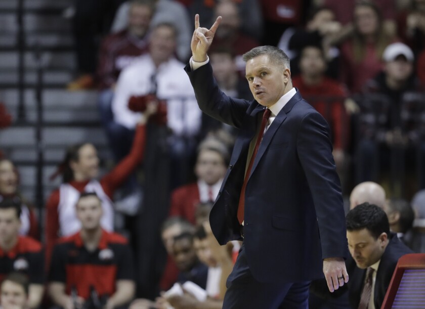 FILE - Ohio State head coach Chris Holtman gestures during the second half of an NCAA college basketball game against Indiana, Sunday, Feb. 10, 2019, in Bloomington, Ind. A telethon hosted by the University of Kentucky’s athletic department has raised more than $3 million in donations with matching funds to benefit victims of last weekend’s deadly tornadoes in western Kentucky. The total included $50,000 from Holtman, a Nicholasville, Ky., native. (AP Photo/Darron Cummings, File)