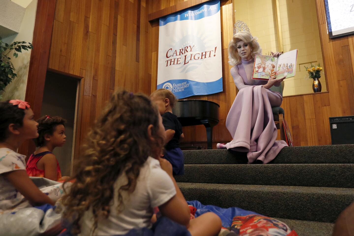 Drag queen Autumn Rose reads to children at Fairview Community Church in Costa Mesa on Wednesday.