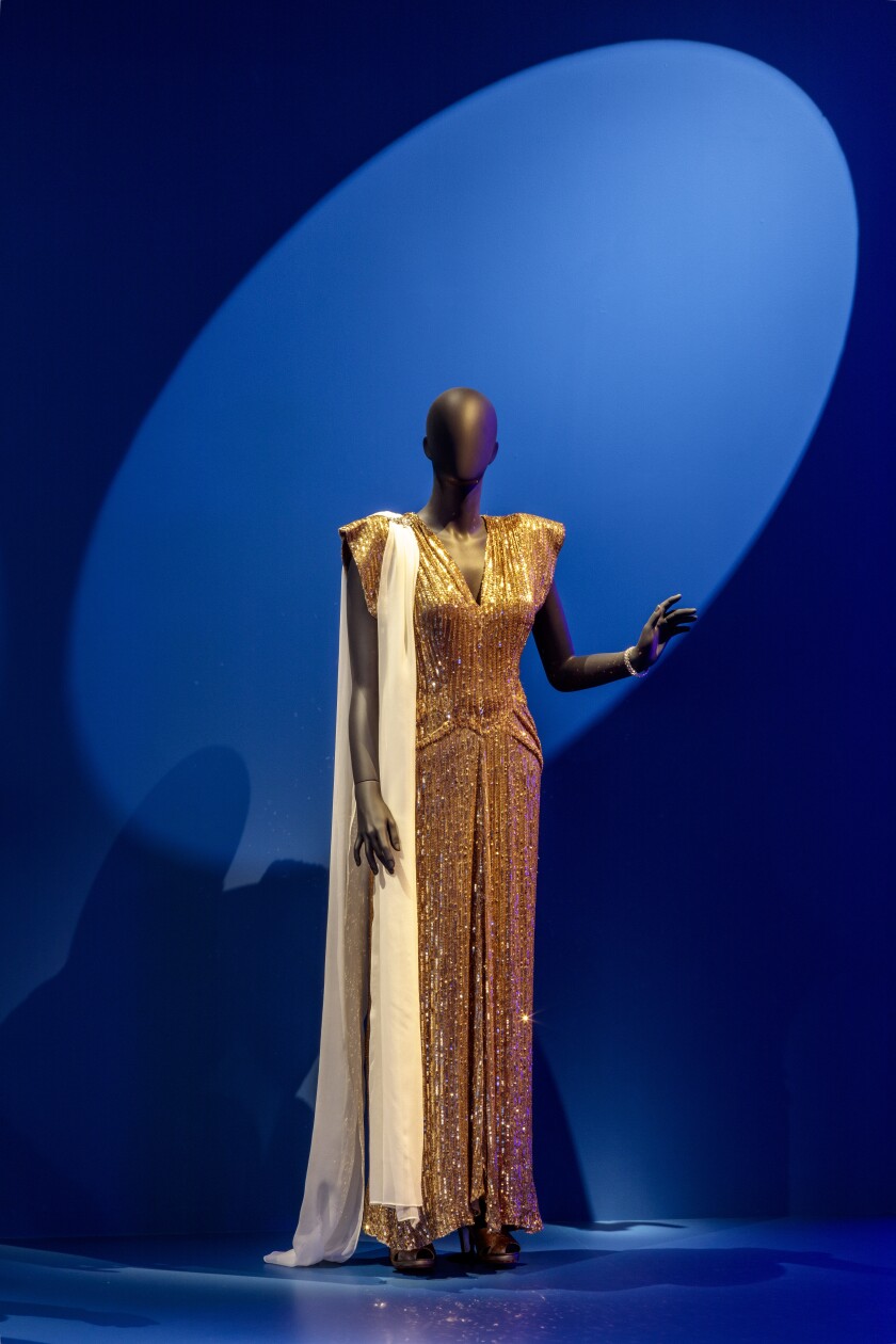 A model wearing a glamorous dress.