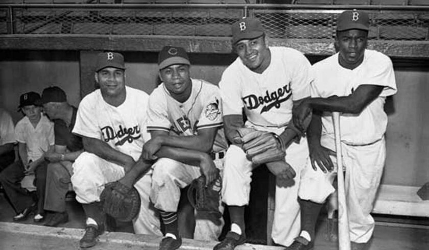 The 1949 All-Star Game included African-American players for the first time. Cleveland's Larry Doby (second from left) was on the AL team while Brooklyn's Roy Campanella (far left), Don Newcombe (second from right) and Jackie Robinson were on the NL squad.
