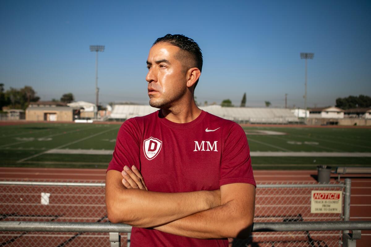 Downey High soccer coach Marvin Mires poses Oct. 30, 2020.