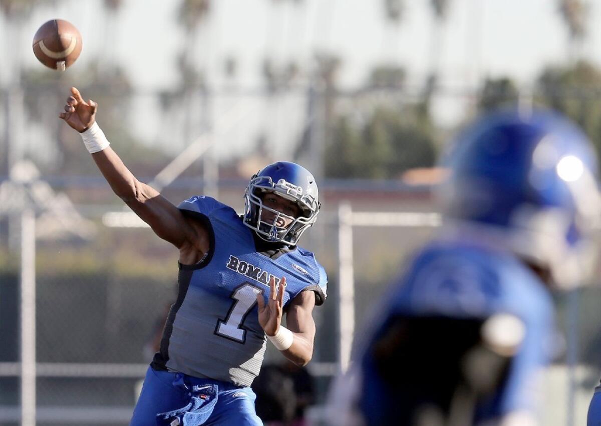Los Angeles High quarterback Kaymen Cureton throws a touchdown pass during a game against Hawkins High on Nov. 6.