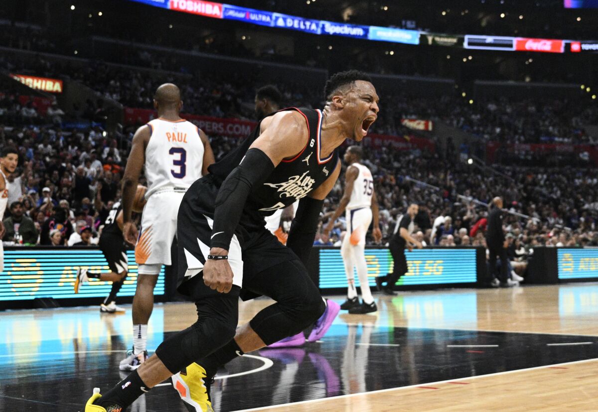 Clippers guard Russell Westbrook celebrates after scoring on a breakaway slam dunk during a 112-100 loss to the Phoenix Suns.