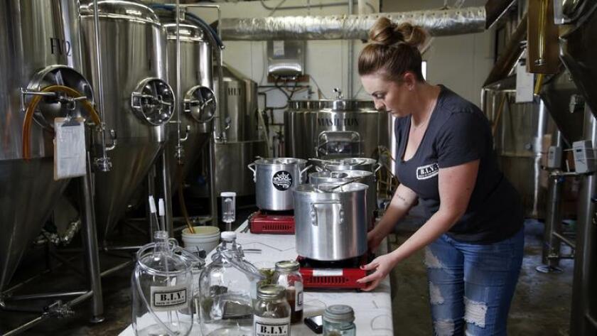 Jenny Seaboldt, who along with husband Trey, operates a DIY brewing business Brew-It-Yourself (B.I.Y.). The Seaboldts provide the equipment, you provide the imagination for a new taste treat. (Nancee E. Lewis)