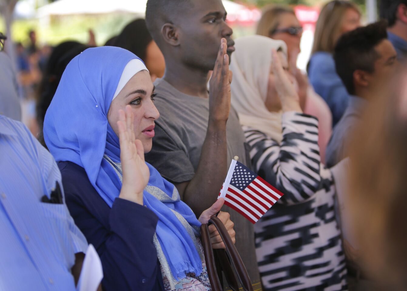 Duaa Saeed, originally from Jordan, was one of about 100 people from about 54 countries who took the Oath of Allegiance to the United States of America and became naturalized U.S. citizens during a naturalization ceremony held in Centennial Plaza near El Cajon City Hall to kickoff El Cajon's, America on Main Street festivities.