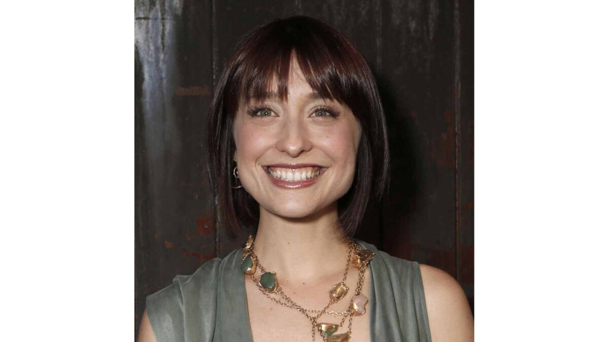 Federal prosecutors say "Smallville" actress Allison Mack, seen on June 26, 2012, has been charged with sex trafficking for helping recruit women to be slaves of a man who sold himself as a self-improvement guru.