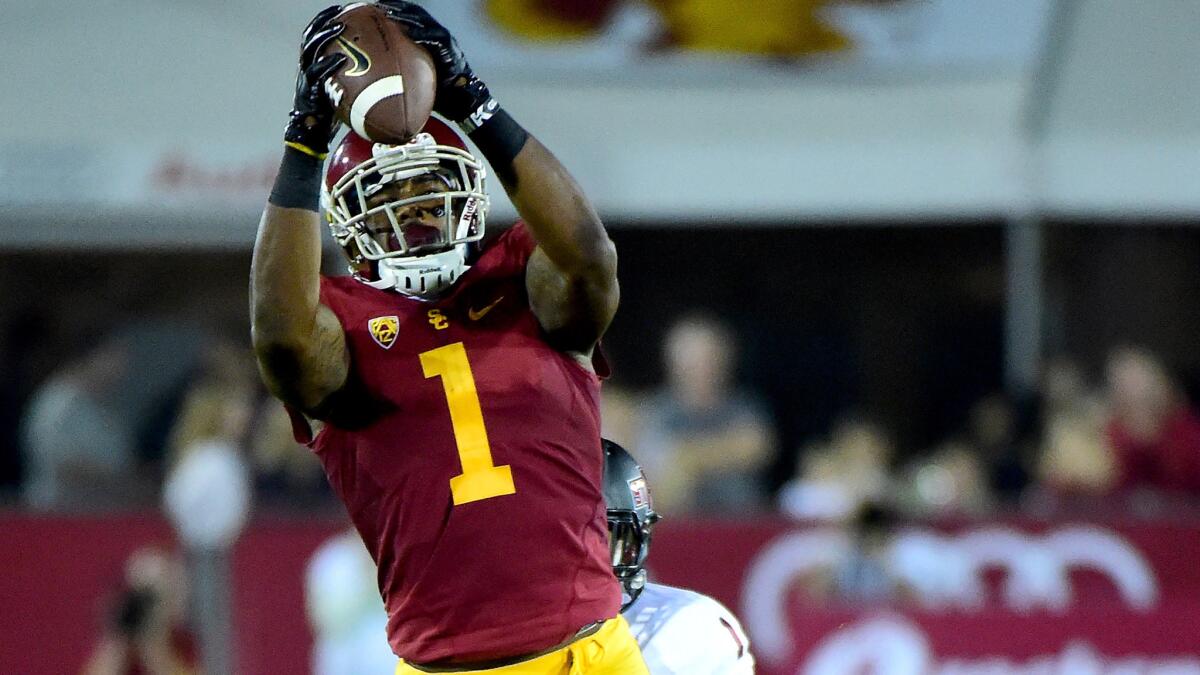 USC receiver Darreus Rogers makes a catch against Arkansas State defensive back Blaise Taylor during the season opener on Sept. 5.