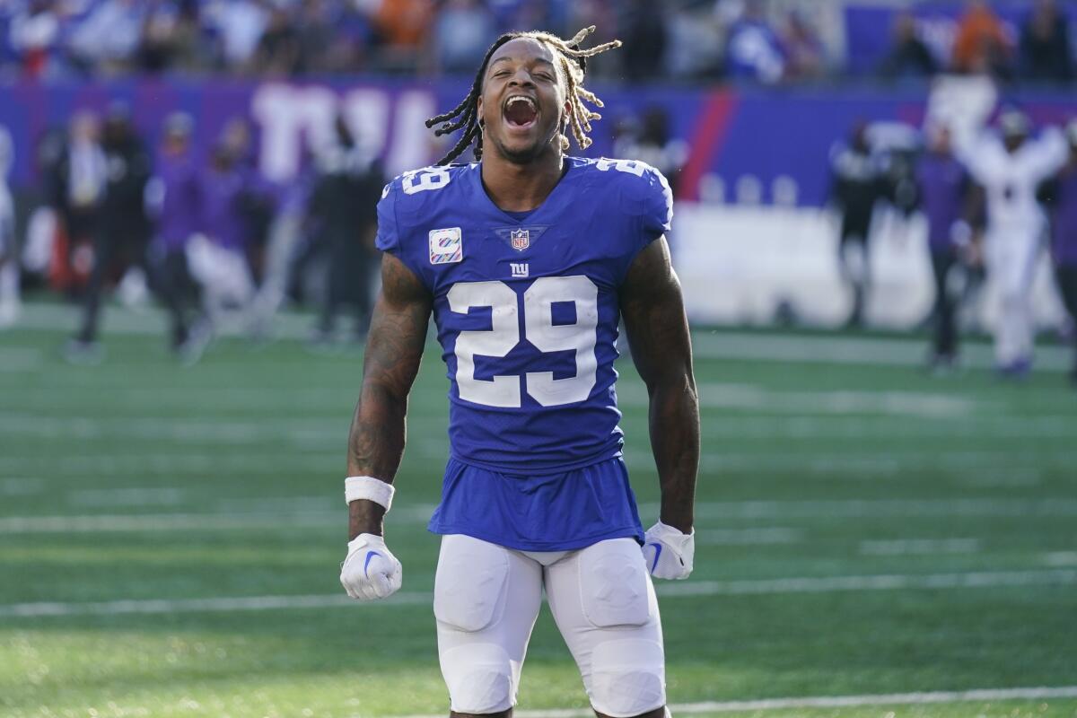 New York Giants safety Xavier McKinney (29) celebrates after an NFL football game against the Baltimore Ravens, Sunday, Oct. 16, 2022, in East Rutherford, N.J. The Giants won 24-20. (AP Photo/Seth Wenig)