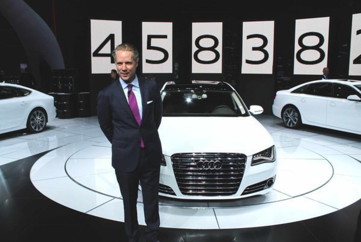 Scott Keogh, president of Audi of America, stands in front of several Audi diesel models the company introduced for the U.S. at the 2012 Los Angeles Auto Show.
