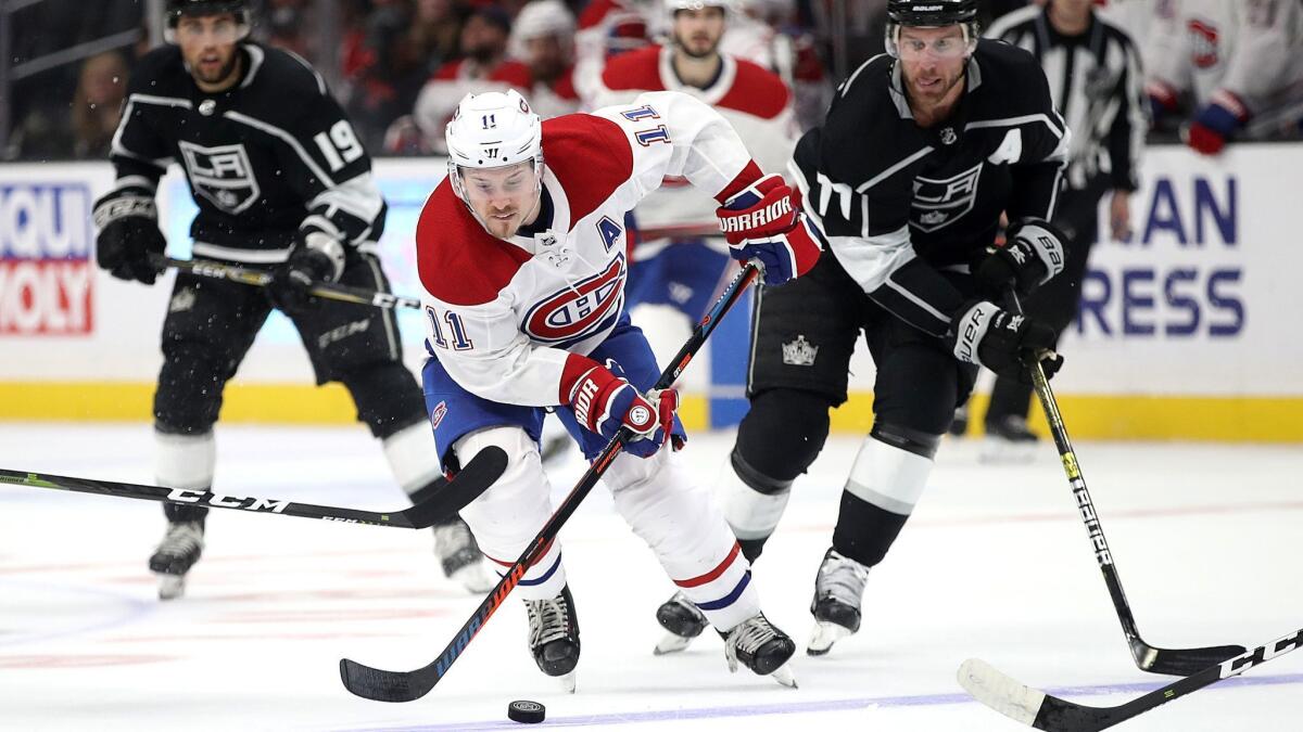 Montreal Canadiens' Brendan Gallagher skates past Kings' Jeff Carter during the third period at Staples Center on Tuesday.