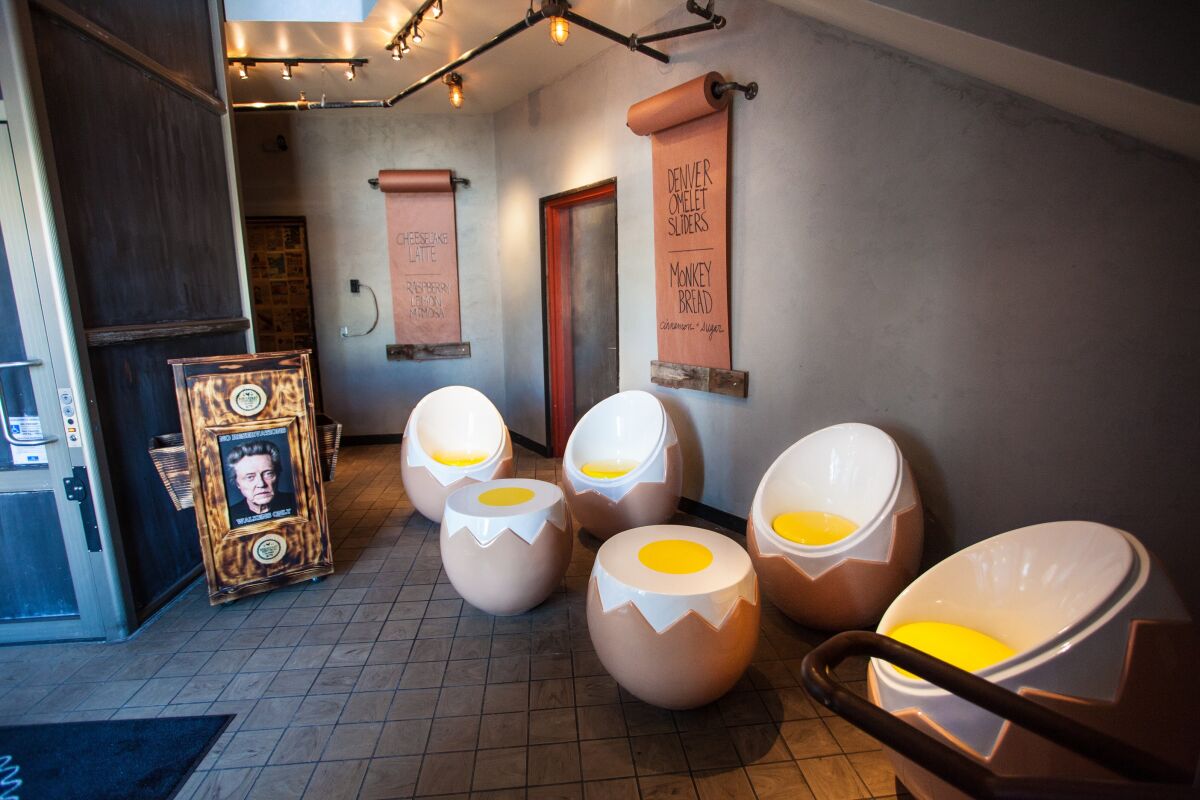 Quirky decor like these egg chairs fills Breakfast Republic's Ocean Beach location.