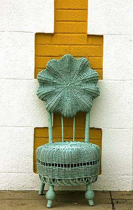 ROYAL REPLICA: Leslie Curtis Antiques aqua-tinted, scaled-down princess wicker chair puts a modern twist on an 1890s Heywood-Wakefield piece. The flower silhouette recalls whimsical pop 60s style.