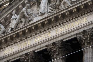 File - The New York Stock Exchange signage glistens in the noon sun on October 4, 2023, in New York. (AP Photo/J. David Ake, File)