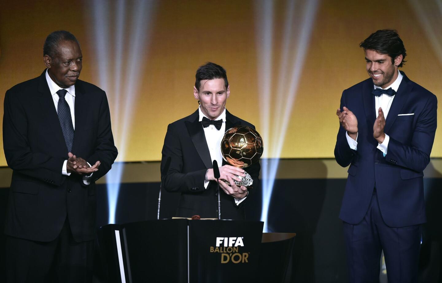 FC Barcelona and Argentina's forward Lionel Messi (C) delivers a speech flanked by FIFA interim president Issa Hayatou (L) and Brazil and Orlando City midfielder Kaka after receiving the 2015 FIFA Ballon dOr award for player of the year during the 2015 FIFA Ballon d'Or award ceremony at the Kongresshaus in Zurich on January 11, 2016. AFP PHOTO / FABRICE COFFRINIFABRICE COFFRINI/AFP/Getty Images ** OUTS - ELSENT, FPG, CM - OUTS * NM, PH, VA if sourced by CT, LA or MoD **