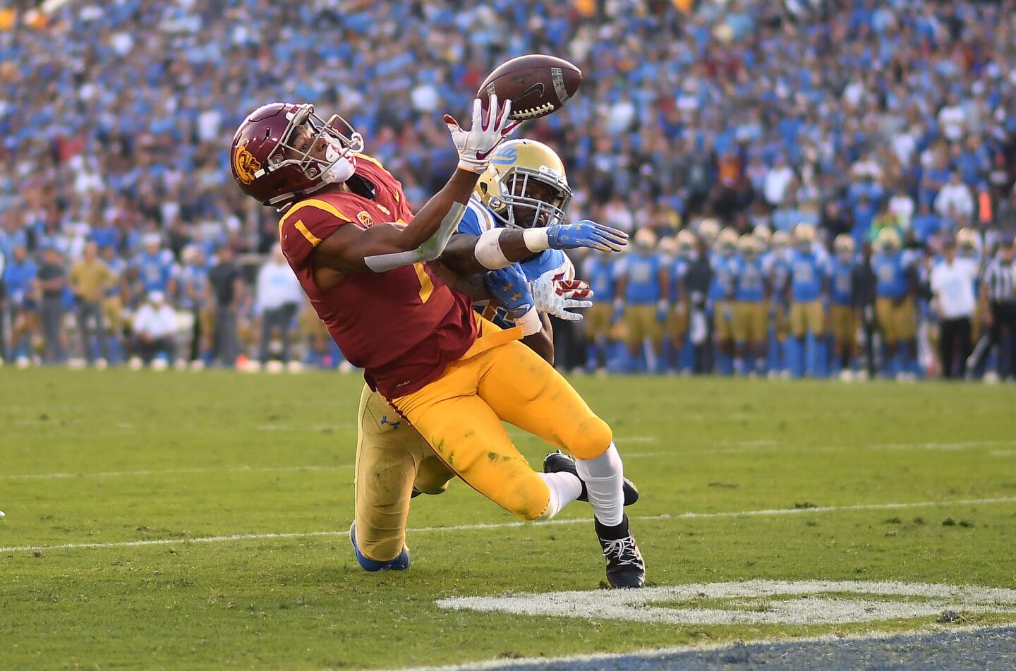 USC receiver Velus Jones Jr. can't make the catch near the end zone as Bruins defensive back Adarius Pickett defends late in the fourth quarter Saturday at the Rose Bowl.