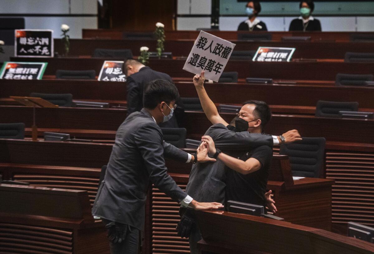 Lawmaker Chan Chi-chuen scuffles with security guards