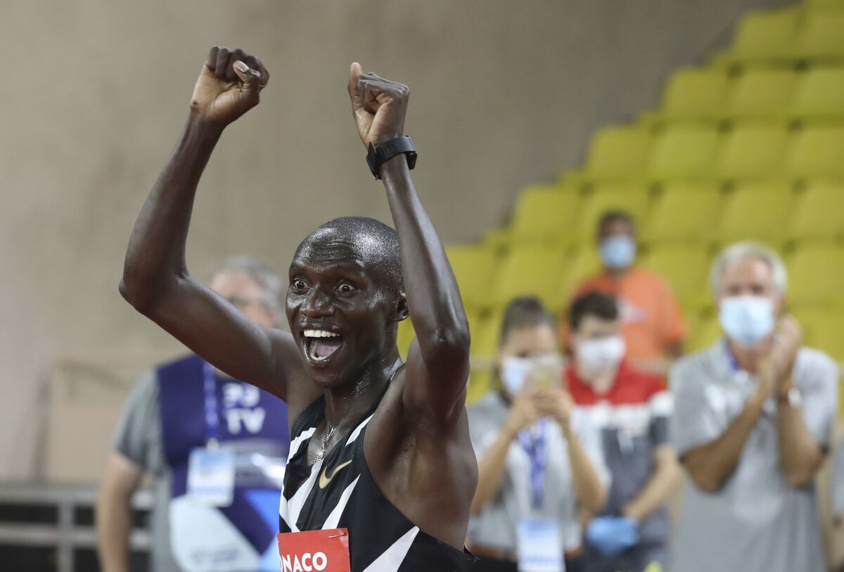 Uganda's Joshua Cheptegei reacts after winning the men's 5000 meters race during the Diamond League athletics meeting at the Louis II stadium in Monaco Friday, Aug. 14, 2020.(Valery Hache /Pool Via AP)