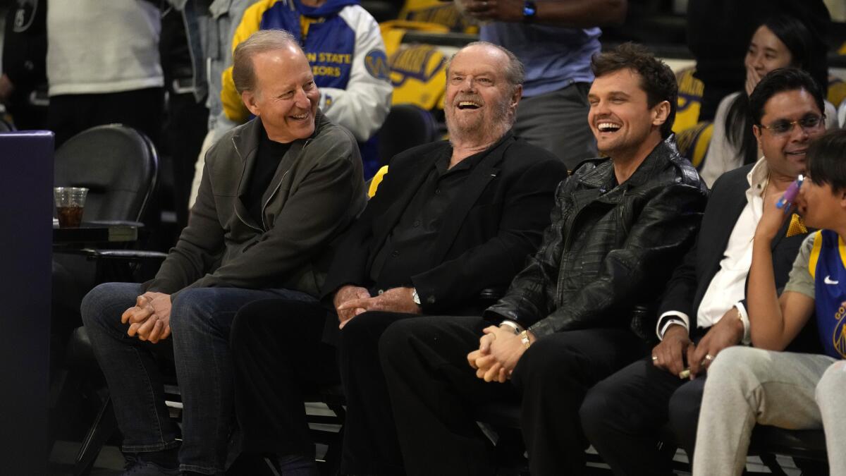 Both played it casual courtside at the Lakers game in 2003.