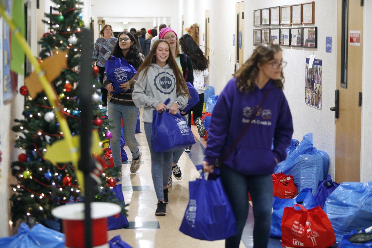Photo Gallery: Burbank Coordinating Council holiday food and toy donation preparations for delivery