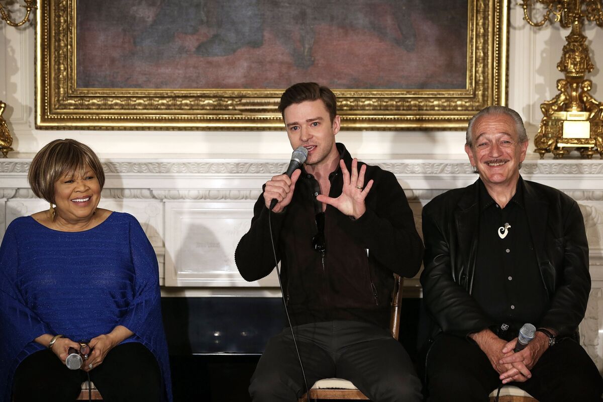 Justin Timberlake, center, speaks as Mavis Staples and Charlie Musselwhite listen during an interactive student workshop, "Soulsville, USA: The History of Memphis Soul," at the White House in Washington, D.C., on April 9, 2013.