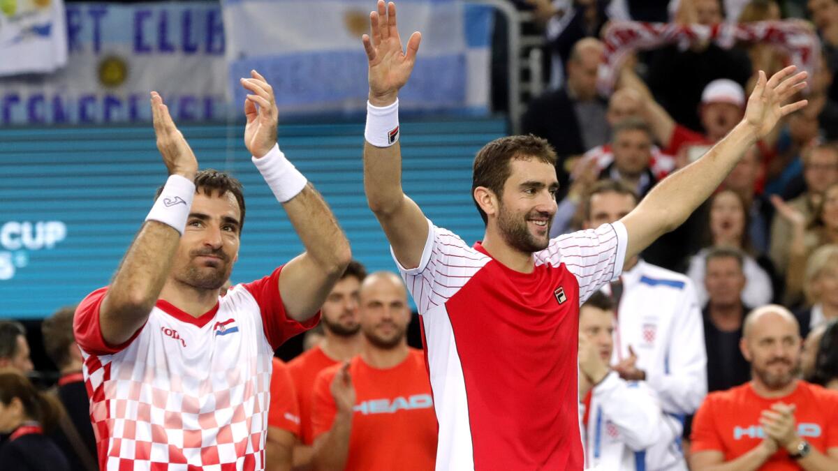 Croatia's Ivan Dodig, left, and Marin Cilic celebrate their doubles victory over Argentina's Juan Martin del Potro and Leonardo Mayer during the Davis Cup final on Saturday.