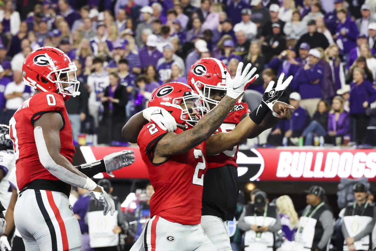 Georgia running back Kendall Milton celebrates after scoring a touchdown in the first half against TCU.