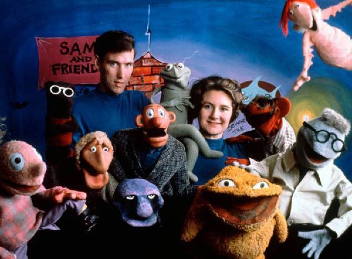 Jane Henson is shown with her husband, Jim Henson, and the cast of "Sam and Friends" in 1960.