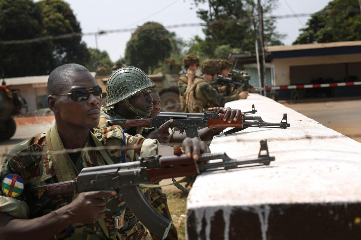 African Union peacekeepers and French troops take up positions at a checkpoint in Bangui, capital of the Central African Republic. Chad plans to withdraw its troops from the peacekeeping mission.