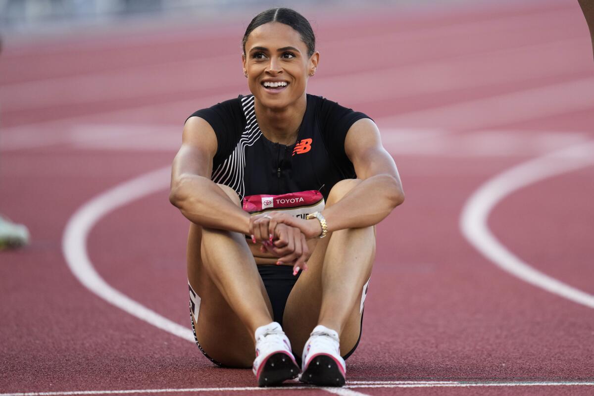 Sydney McLaughlin-Levrone smiles as she catches her breath after winning the women's 400 meter final.