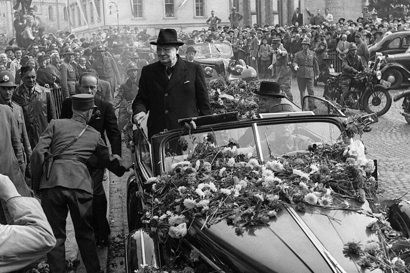 British Prime Minister Winston Churchill is welcomed by thousands as he arrives in Zurich, Switzerland, Sept. 19, 1946. Churchill later that day spoke at Zurich University where he called for the unification of Europe and said, "Let Europe arise." Churchill received a hero's welcome when he visited the neutral country, soon after he had given his famous speech about an ``iron curtain'' descending across Europe in reference to Soviet-led communism. (AP Photo/Keystone) MANDATORY CREDIT