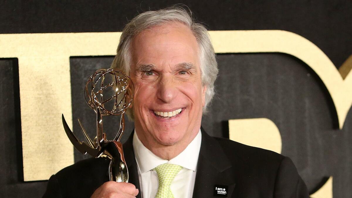 Henry Winkler holds his statue at HBO's post-Emmy Awards reception at the Pacific Design Center.