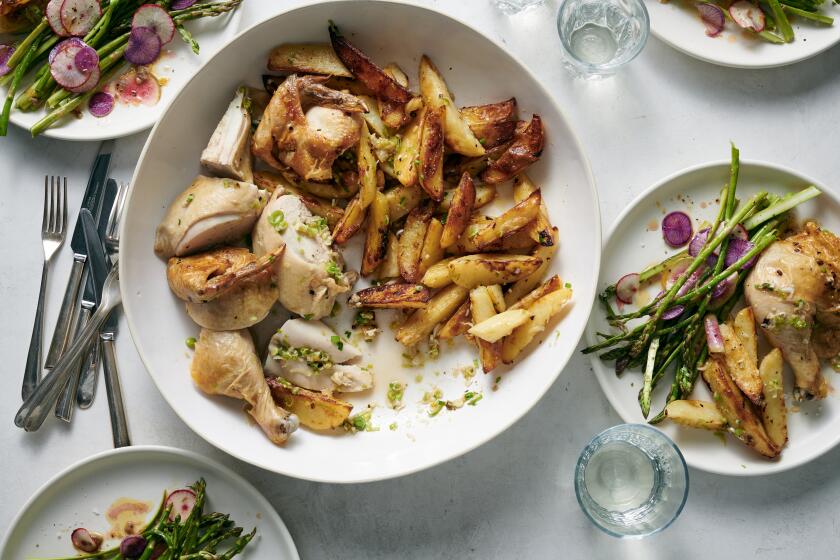 Roast chicken with green garlic, herbs and potatoes served with shaved asparagus and radish salad.