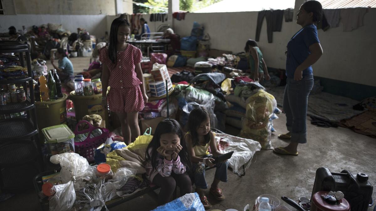 Marawi residents who fled fighting between Philippine soldiers and Islamic State-backed militants rest in an evacuation center in Marawi city, southern Philippines.