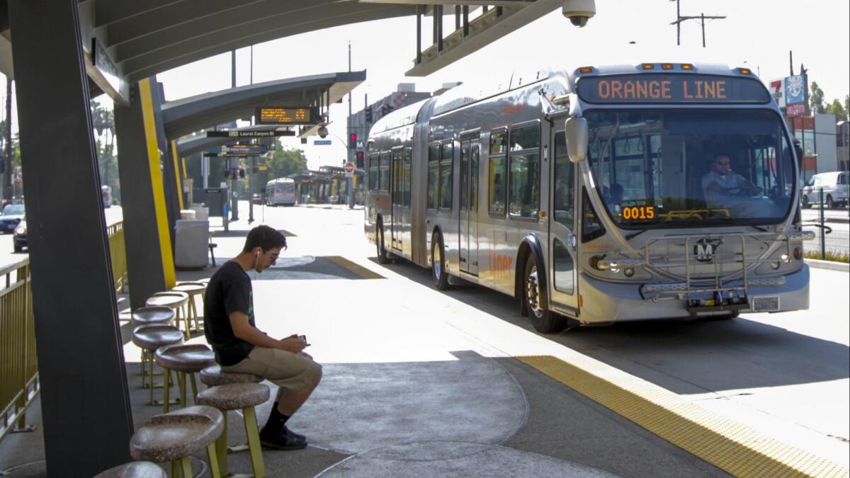 The Metro Orange Line bus going through North Hollywood station on Oct. 20, 2017. The first electric buses Metro buys will only run along the Orange Line busway in the San Fernando Valley and in the carpool lanes along the Harbor and El Monte freeways, officials say.