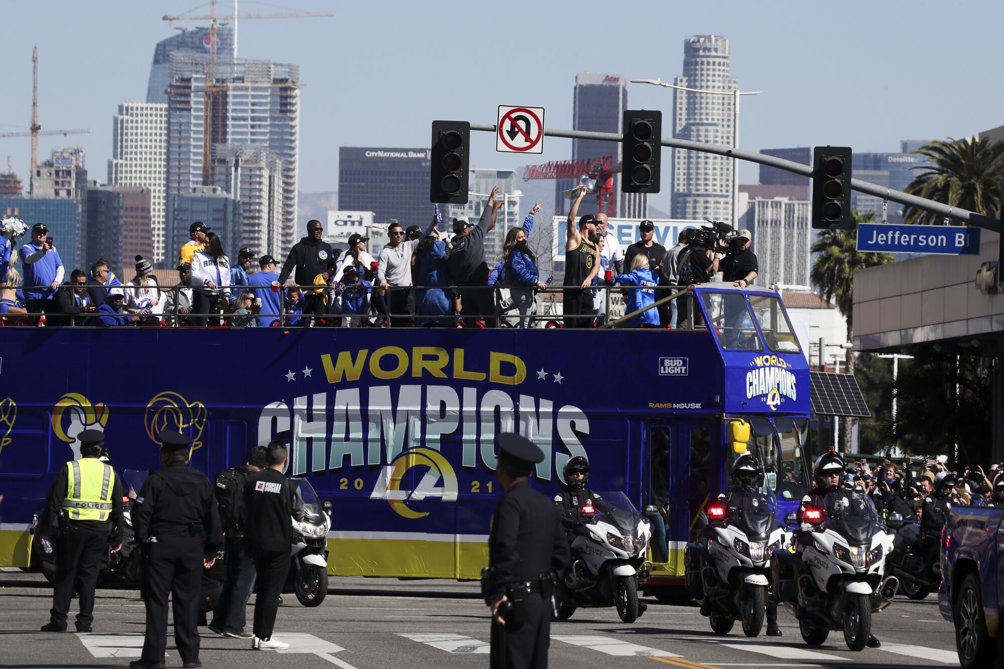 MVP Cooper Kupp holds up the Lombardi Trophy during the Rams' Super Bowl victory parade.