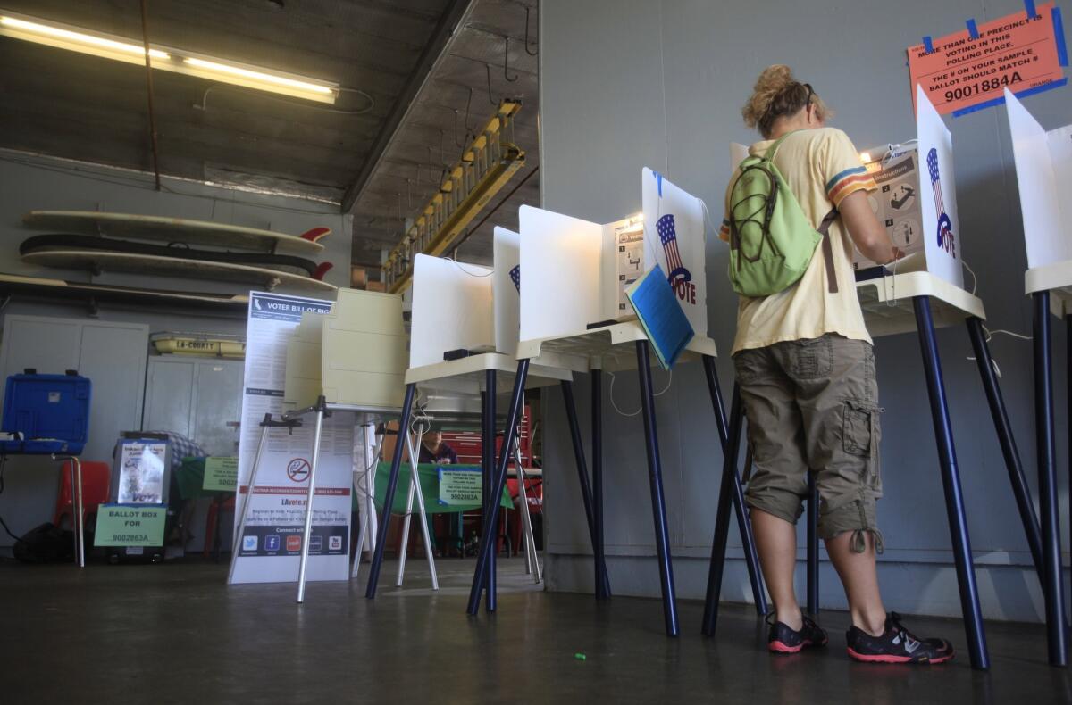 Ellen Kotheimer of Venice votes by herself in June at the Los Angeles County Lifeguard station in Venice.