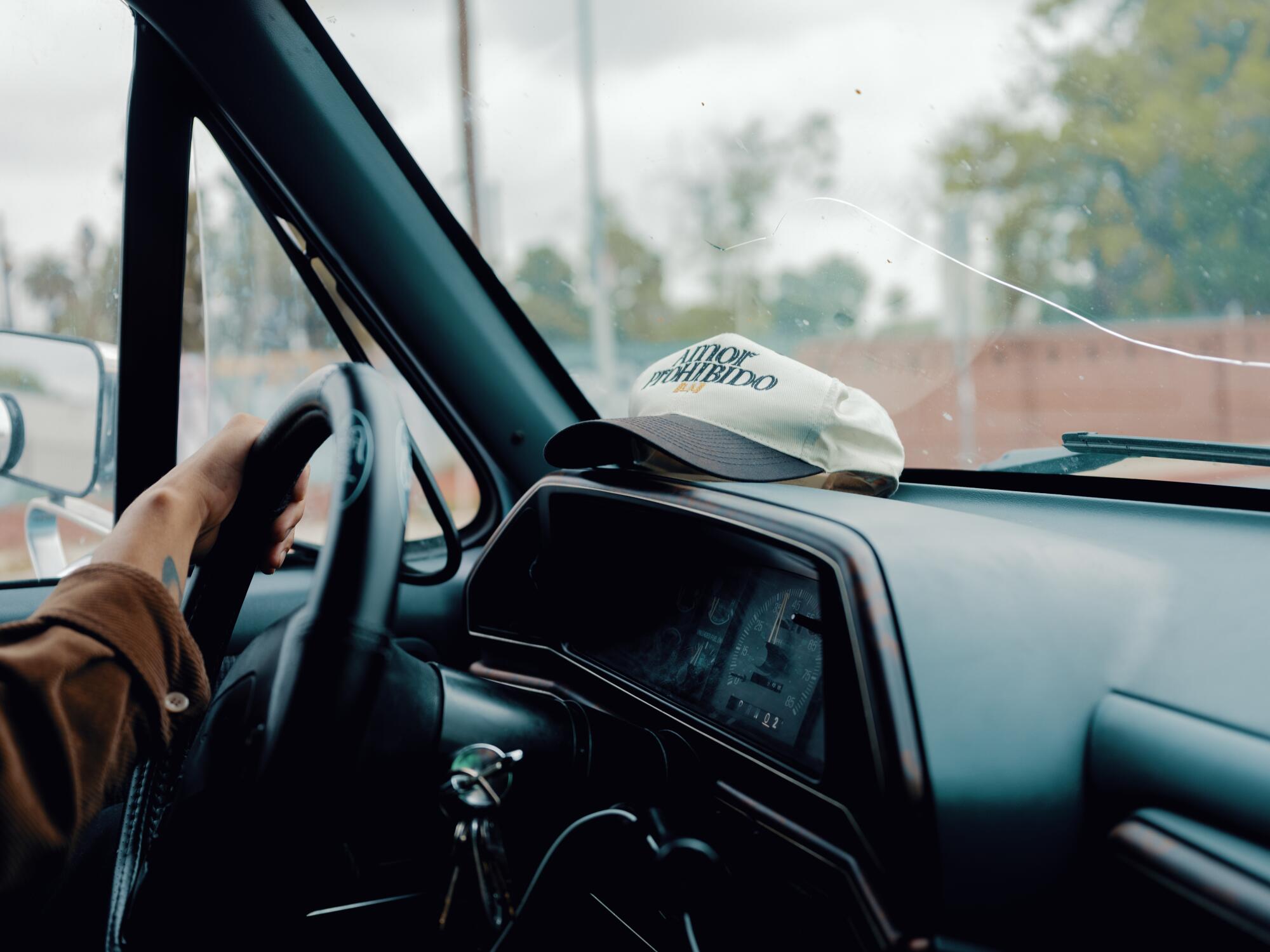 Preciado behind the wheel of his ’91 baby blue Ford F-150.