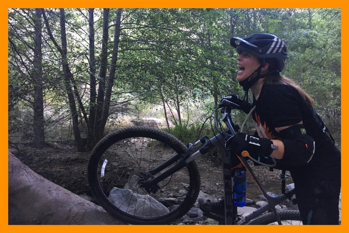 Jaclyn on their mountain bike.