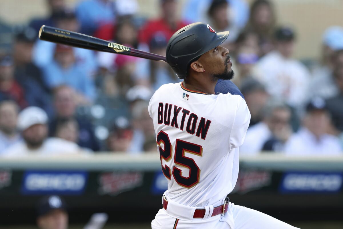 Minnesota Twins' Byron Buxton flies out to New York Yankees right fielder Giancarlo Stanton during the first inning of a baseball game Wednesday, June 8, 2022, in Minneapolis. (AP Photo/Stacy Bengs)