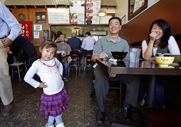 Rachel Wong, 3, her father, Bryan Wong, and her mother, Yoshiun Wong, dine at Ramen Yamadaya in Torrance.