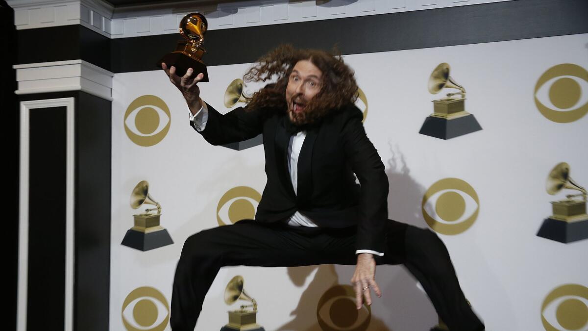 "Weird Al" Yankovic celebrates his win backstage at the 61st Grammy Awards.